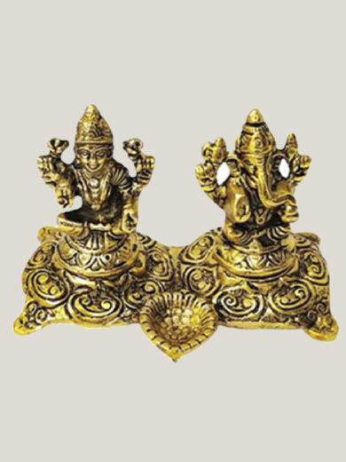 Statue of Lakshmi and Ganesha with a Diya